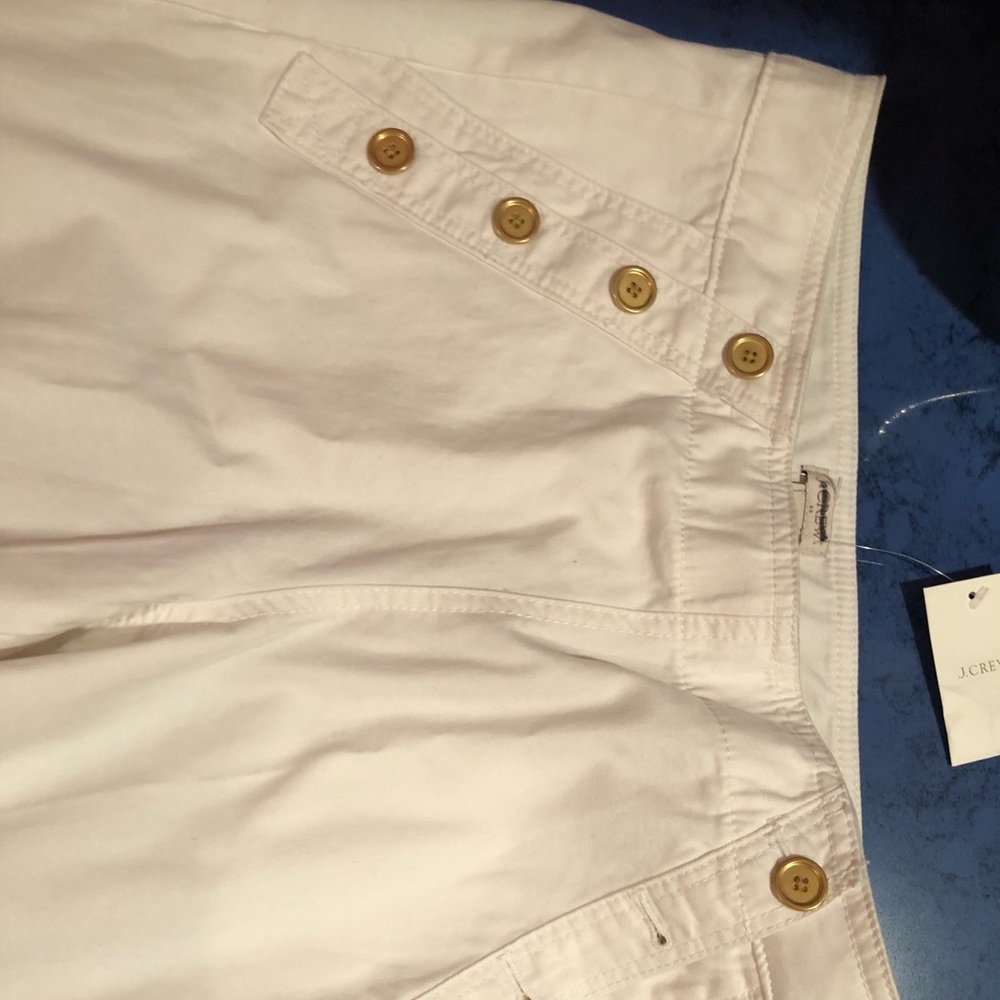 White pants gold buttons